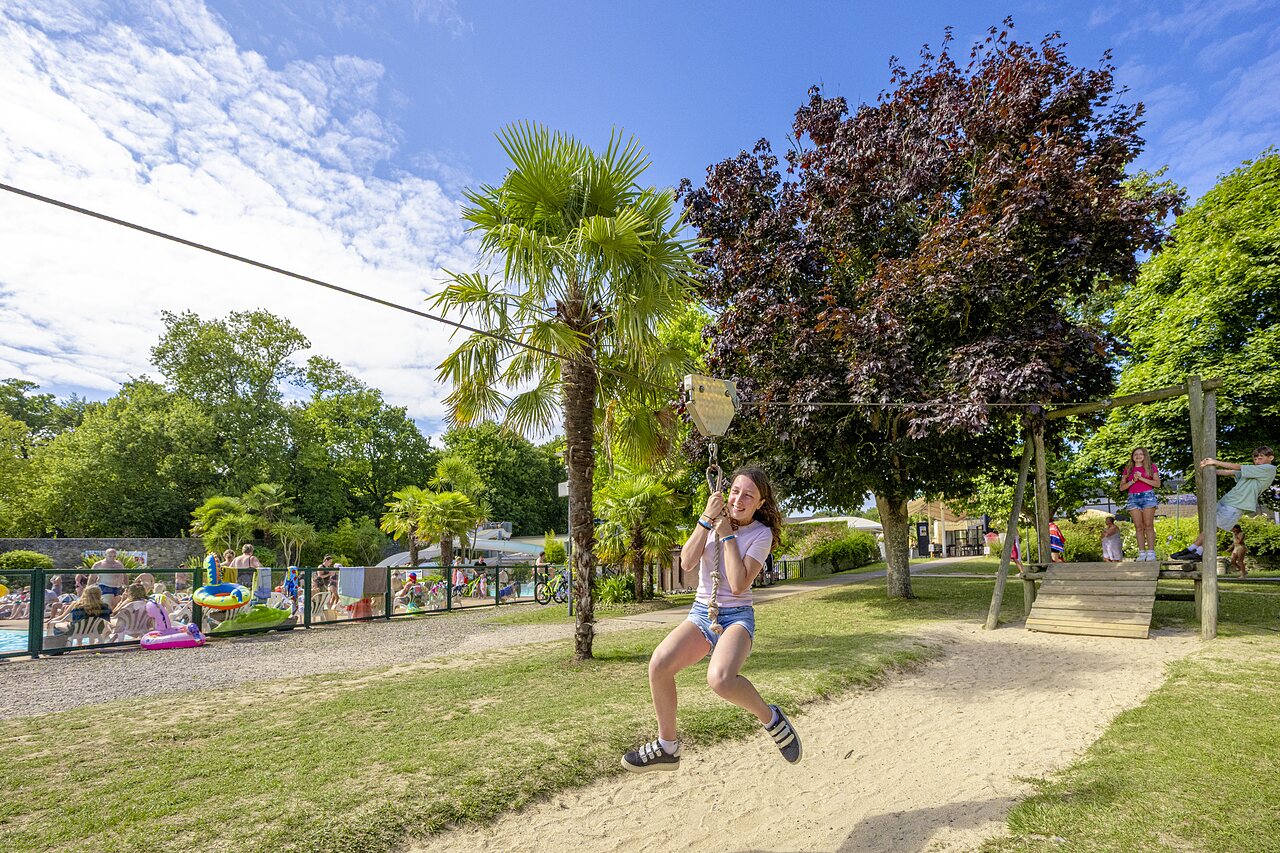 Zip line, playground and swimming pool at CAPFUN Ch�teau de Galin�e campsite in SAINT CAST LE GUILDO (22).