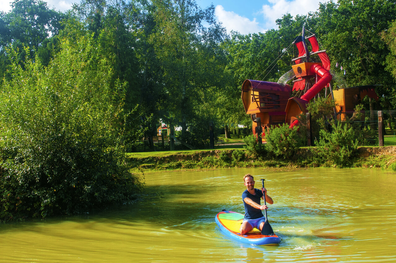Paddleboarding on the pond at CAPFUN Chateau d'Arvid campsite in Villerville.