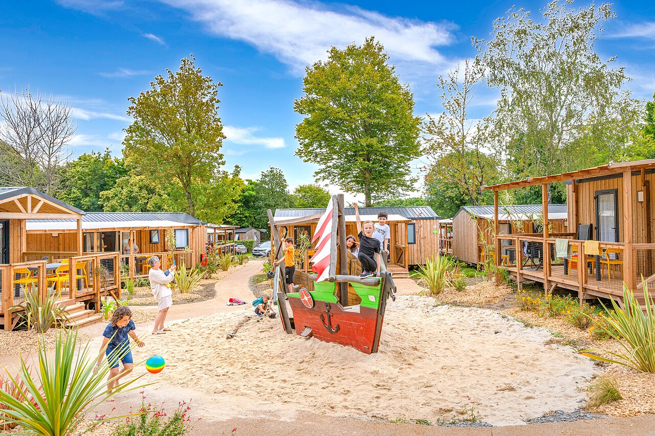 Mobil-homes, children's play area at CAPFUN La Ch�naie campsite in PORNIC (44).