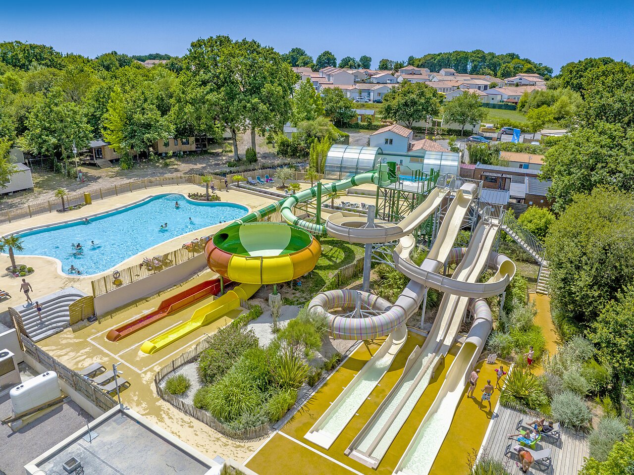 Various water slides and large outdoor swimming pool at CAPFUN La Ch�naie campsite in PORNIC (44).