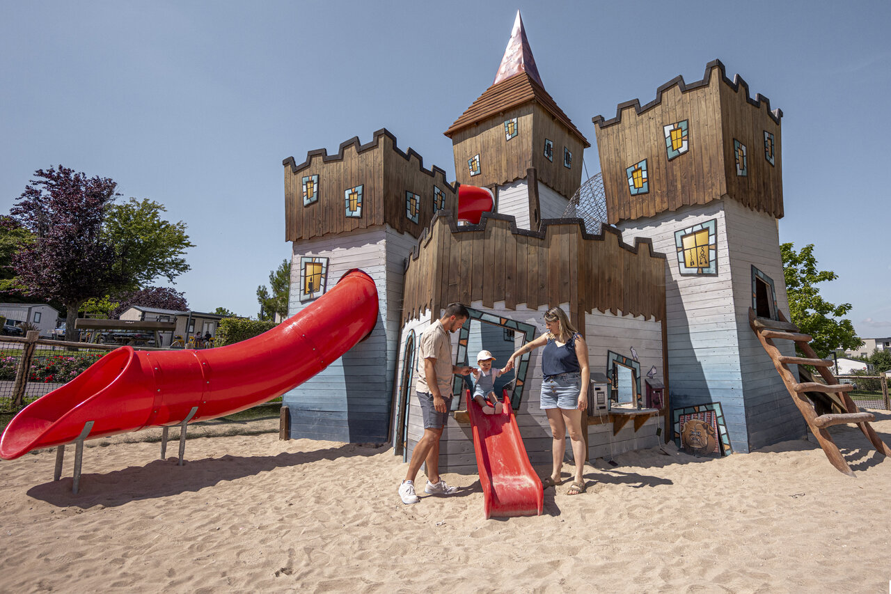 Castle playground, slides and family at CLICOCHIC Chevaliers campsite HOULGATE (14).