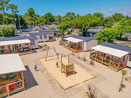 Playground, modern mobile homes, aerial view at camping CLICOCHIC Chouans (85).