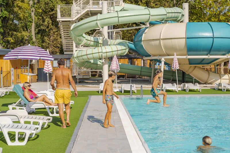 Outdoor pool, water slides, family at CAPFUN Citta di Angera campsite VA.