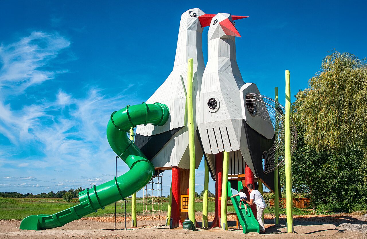 Giant stork playground, green slide at camping CLICOCHIC Au Clair Ruisseau Gerstheim.