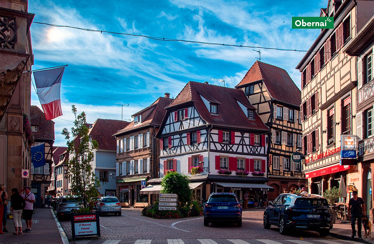 Picturesque street with half-timbered houses in Obernai, an Alsatian town.