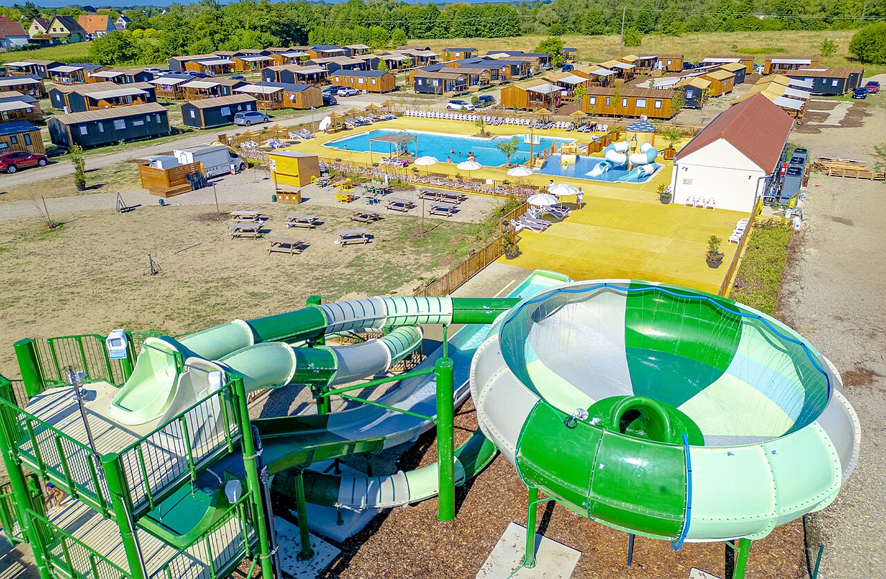 Giant water slides and outdoor pool at camping CLICOCHIC Au Clair Ruisseau Gerstheim (67).