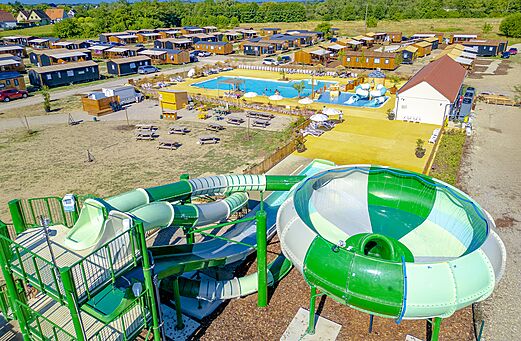 Giant water slides and outdoor pool at camping CLICOCHIC Au Clair Ruisseau Gerstheim (67).