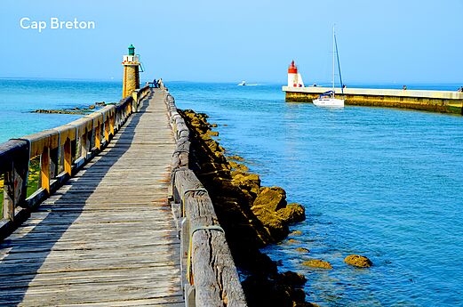 Long wooden pier and lighthouses of Capbreton port, Landes, Nouvelle-Aquitaine.