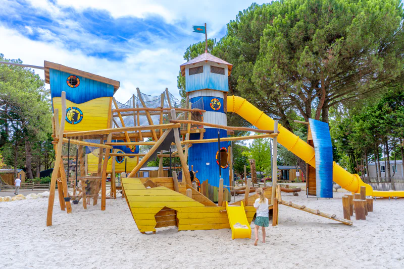 Pirate ship playground, slides, nets at VAGUES OCEANES Coq Hardi campsite in Cassy-Lanton (33).
