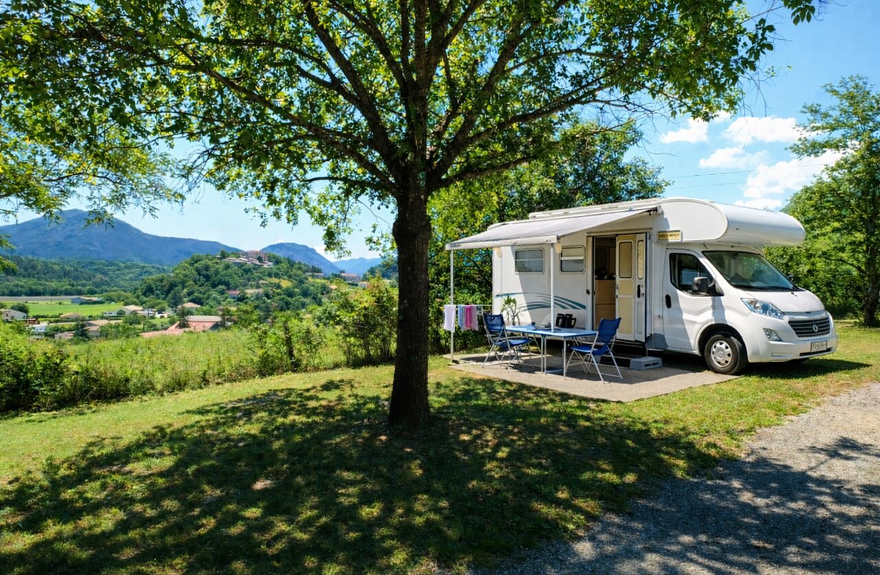 Shaded motorhome pitch, mountain view, CLICOCHIC Couriou campsite, Recoubeau-Jansac.