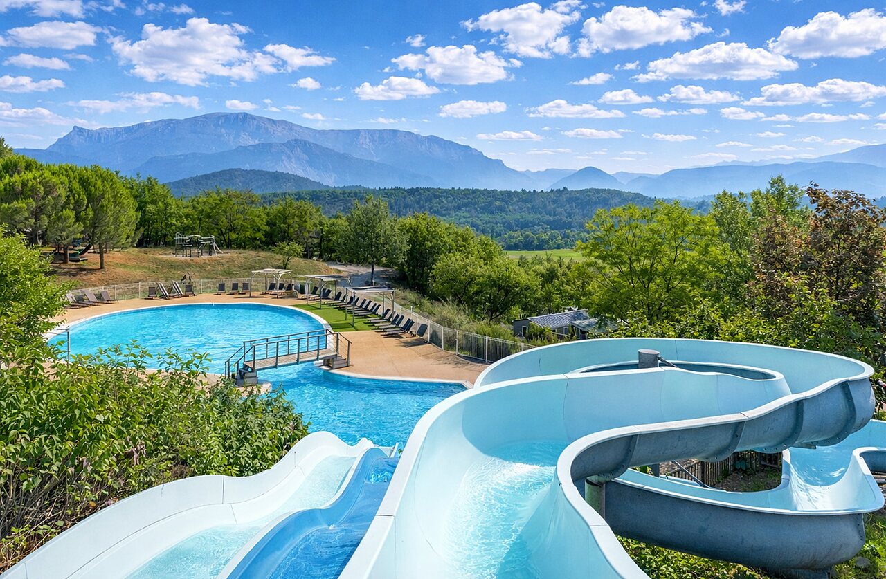 Outdoor pool, water slides, mountainous setting at CLICOCHIC Couriou campsite in Recoubeau-Jansac.