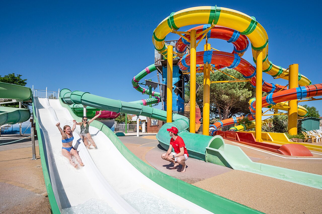 Children on colorful water slides, CAPFUN Curty's campsite in Jard sur Mer (85).