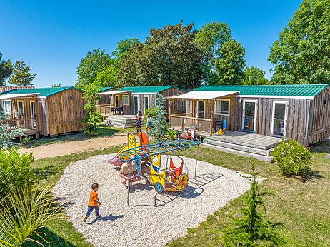 Children's playground, Mobile homes at CAPFUN Curty's campsite in Jard sur Mer (85).