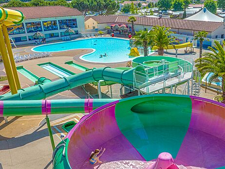Giant water slides and outdoor pool at CAPFUN Curty's campsite Jard sur Mer (85).