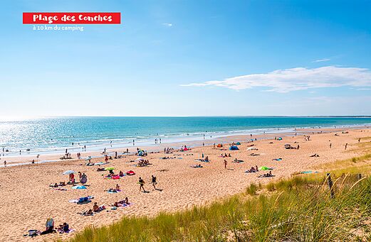 Plage des Conches, wide sandy beach with swimmers near Jard sur Mer.
