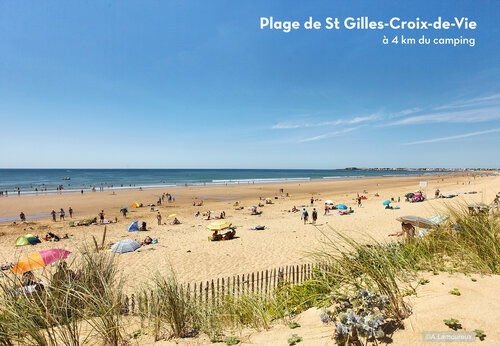 Wide sandy beach in Saint-Gilles-Croix-de-Vie, Vendée, perfect for swimming.