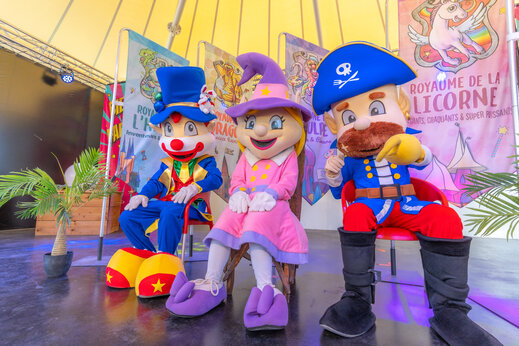 Colorful mascots on stage for children's entertainment at CAPFUN Dauphins Bleus campsite in GIVRAND (85).