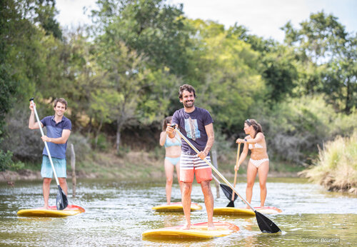 Water activities, people paddleboarding at CAPFUN Dauphins Bleus campsite in GIVRAND (85).