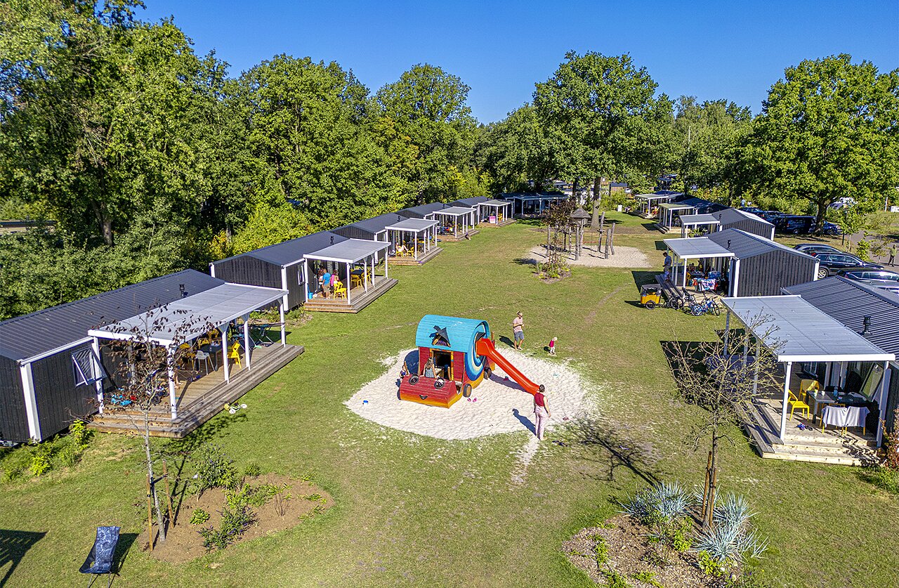 Aerial view mobile homes and playground at CAPFUN De Belten campsite in Rheeze.