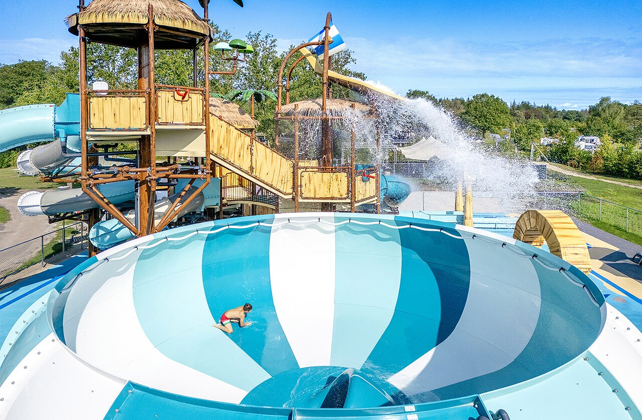 Bowl slide, child at CAPFUN De Belten campsite in Rheeze.