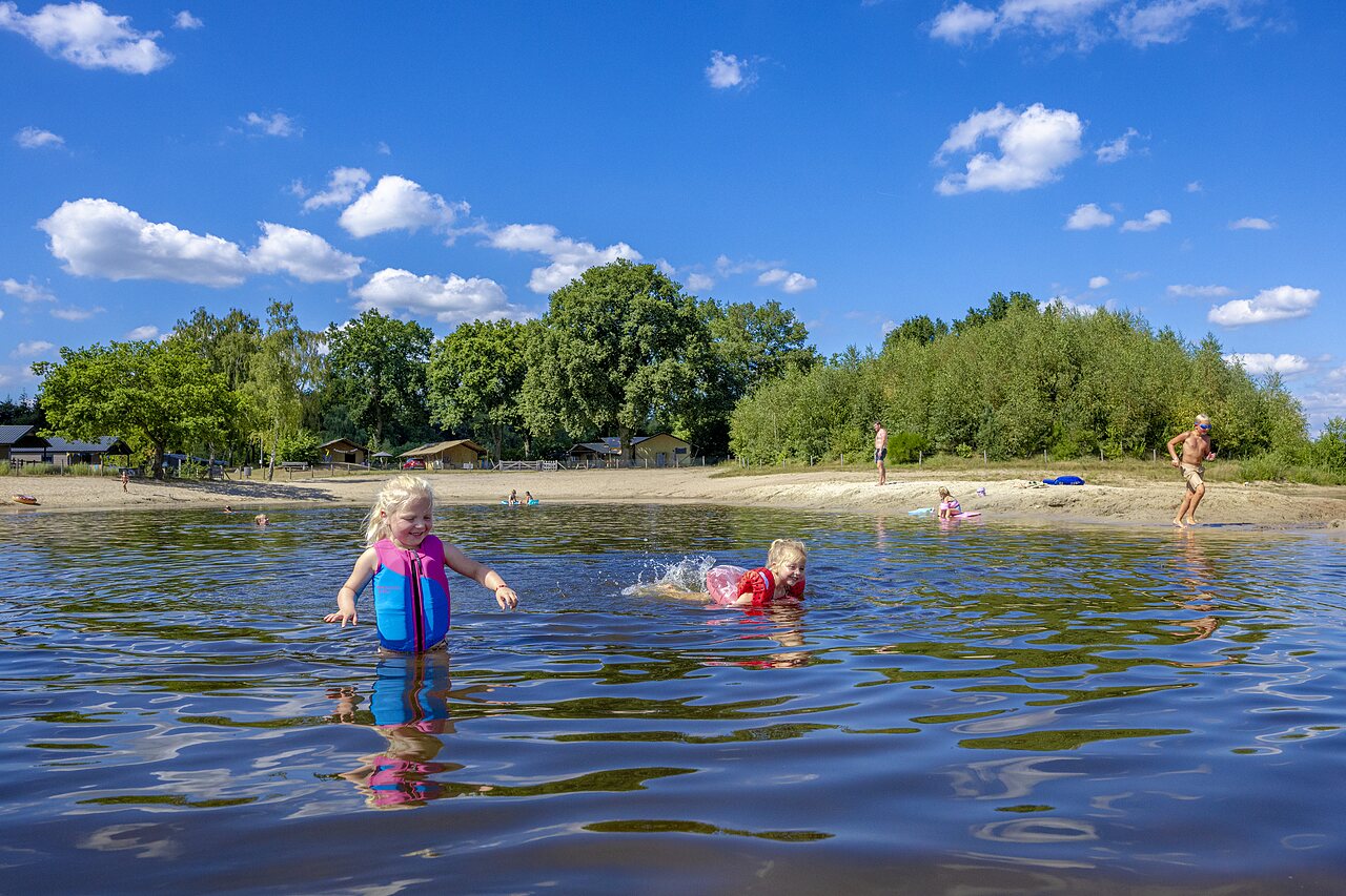 Kids playing in the lake and on the beach at CAPFUN De Belten, Rheeze.