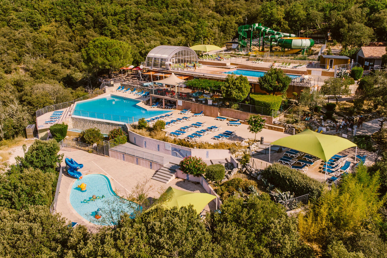 Swimming pools, water slides, solarium at LIBRANOO Naturiste Sabliere campsite in Barjac (30).