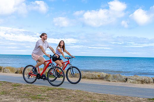 Bicycles by the sea at CAPFUN Donjon de Lars campsite in Courseulles-sur-Mer.