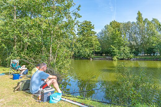 Fishing by the pond at CAPFUN Dune Fleurie campsite in Quend Plage.