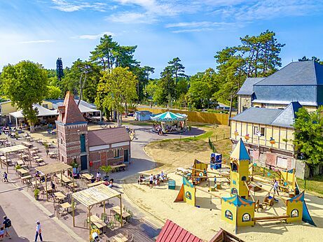 Restaurant terrace and playground at CAPFUN Dune Fleurie Quend Plage.