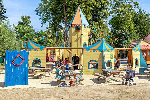 Colorful castle playground with children at CAPFUN Dune Fleurie, Quend Plage.