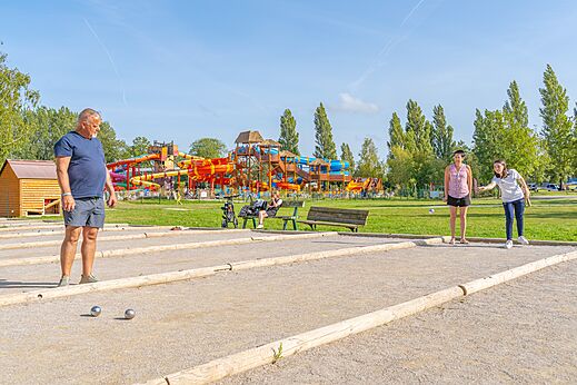Petanque court with players at CAPFUN Dune Fleurie campsite in Quend Plage (80).