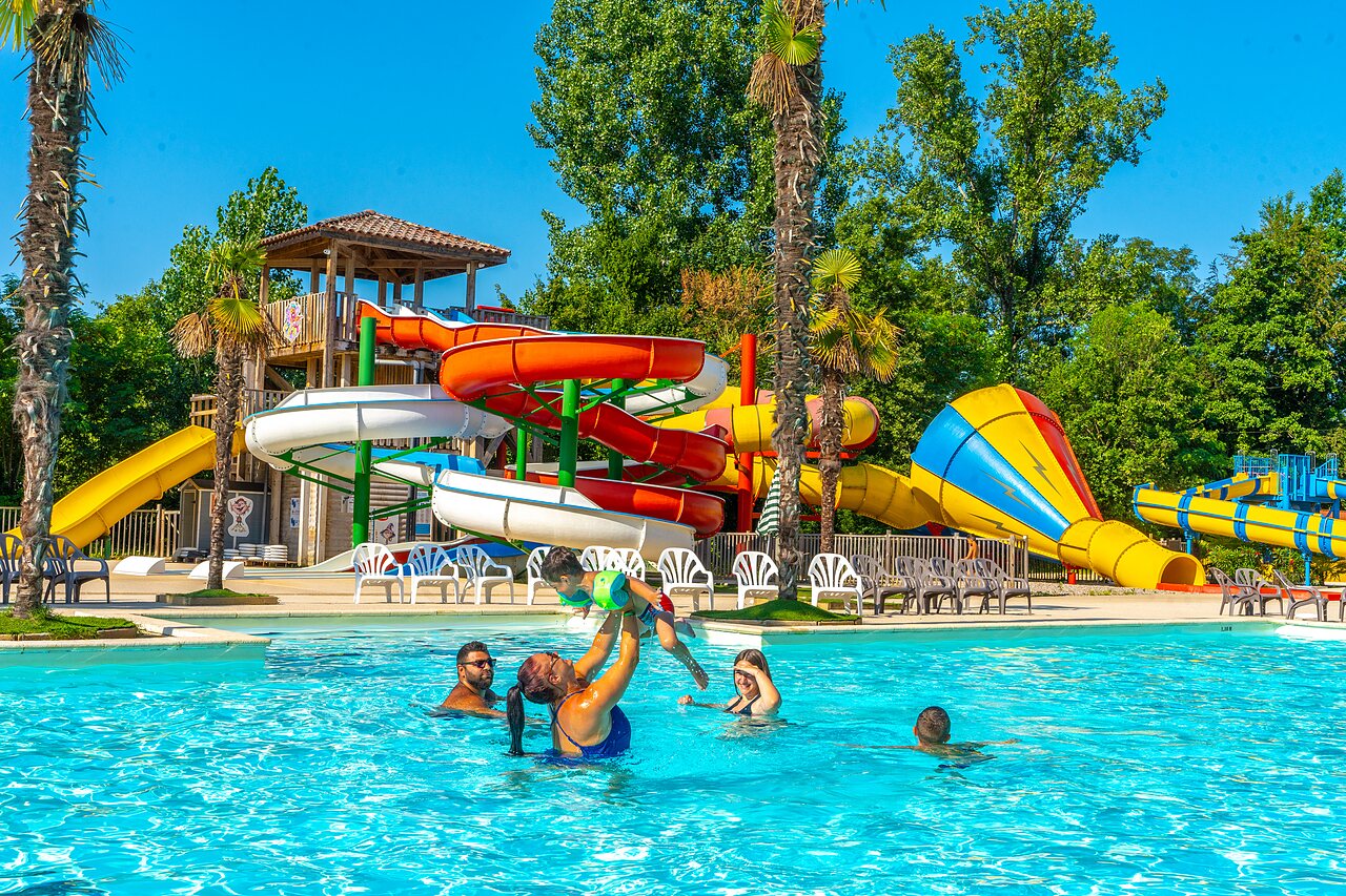 Outdoor pool, large colorful water slides at CAPFUN Duravel campsite (46).