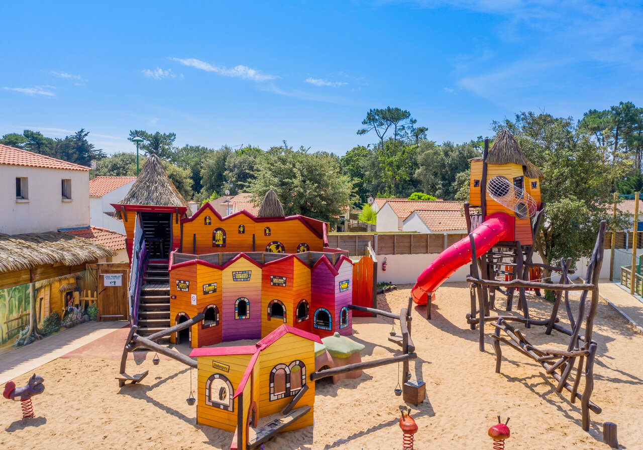 Giant slide, colorful playground, playhouses at CAPFUN Ecureuils campsite in JARD SUR MER (85).