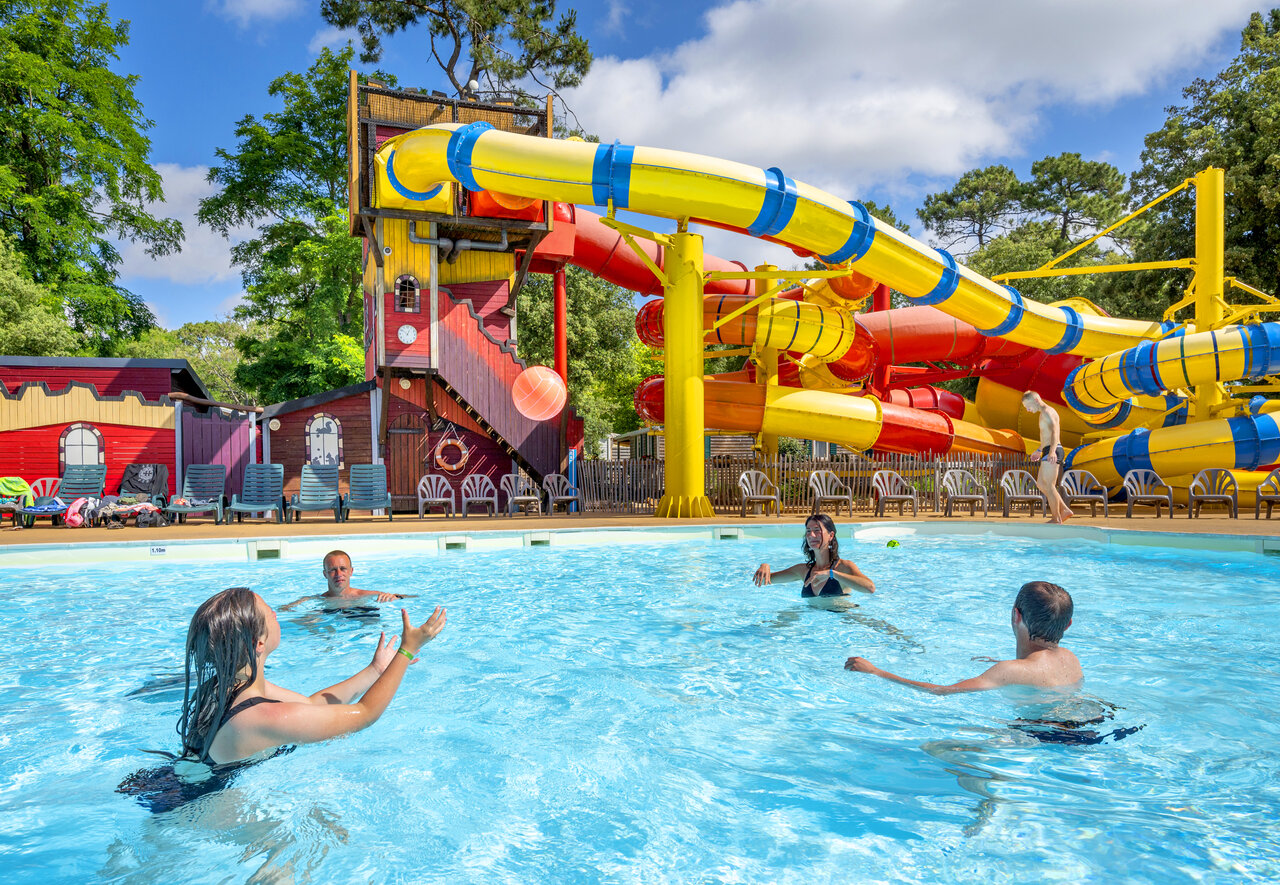 Outdoor pool, colorful water slides at CAPFUN Ecureuils campsite in JARD SUR MER (85).