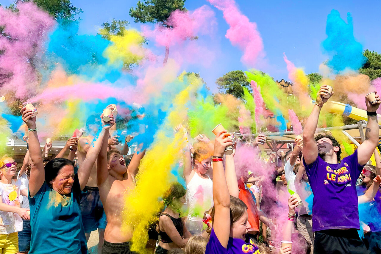 Colorful animation Holi powder, joyful participants at CAPFUN Ecureuils campsite in JARD SUR MER (85).