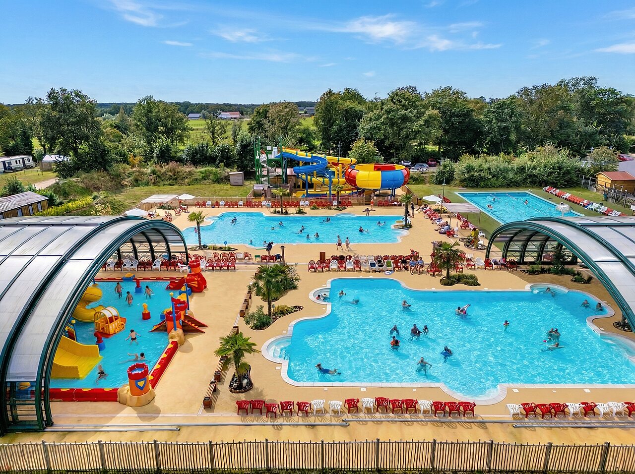 Large water park with pools, slides, and water games at CAPFUN Eibernest campsite in Eibergen.