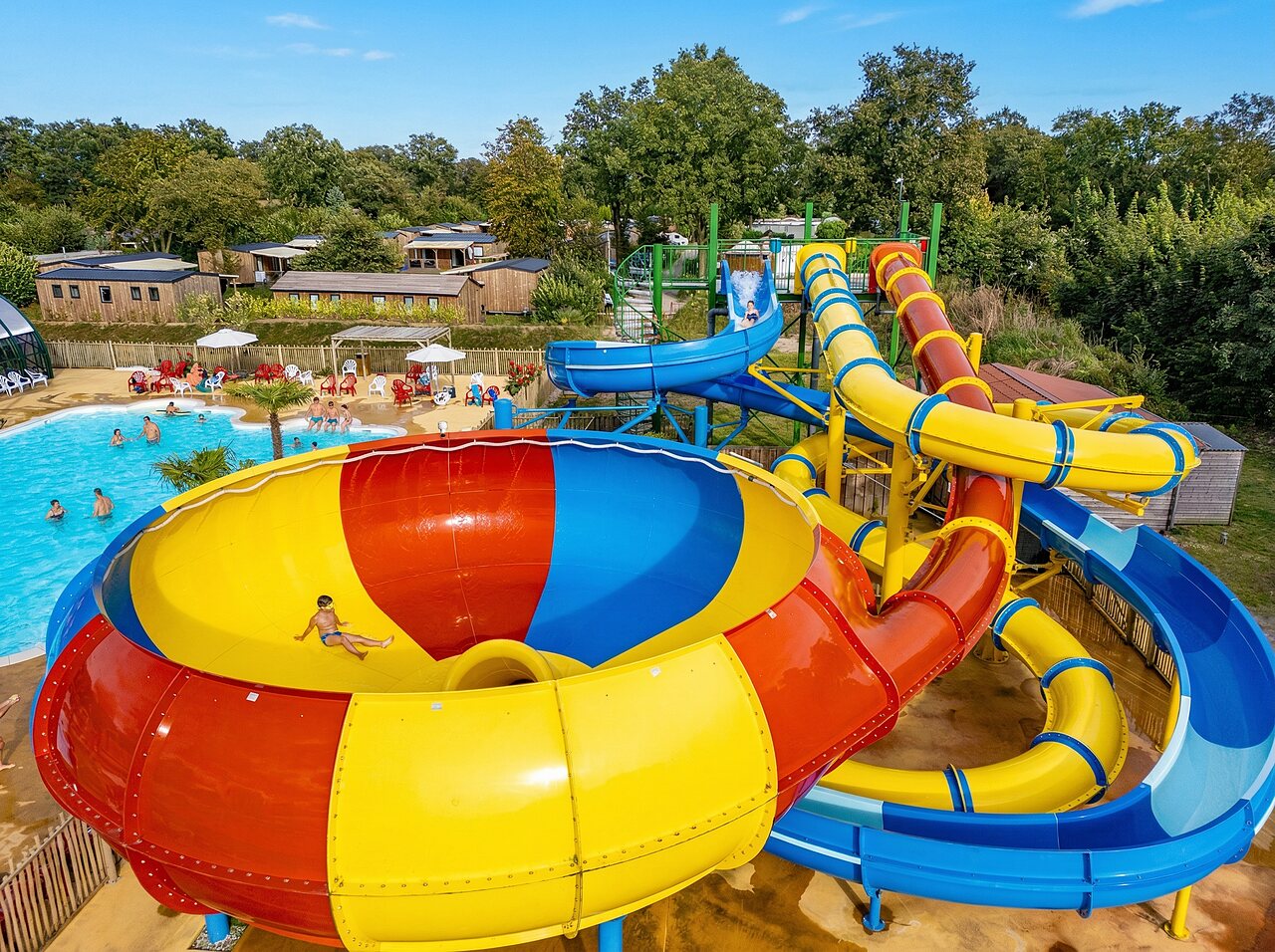 Colorful water slides and swimming pool at CAPFUN Eibernest campsite in Eibergen.