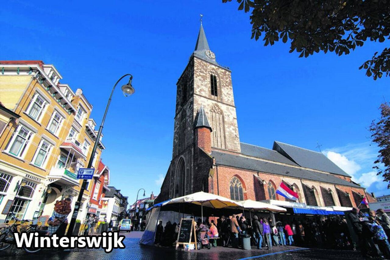 Jacobskerk church and lively market in Winterswijk town square, Netherlands.