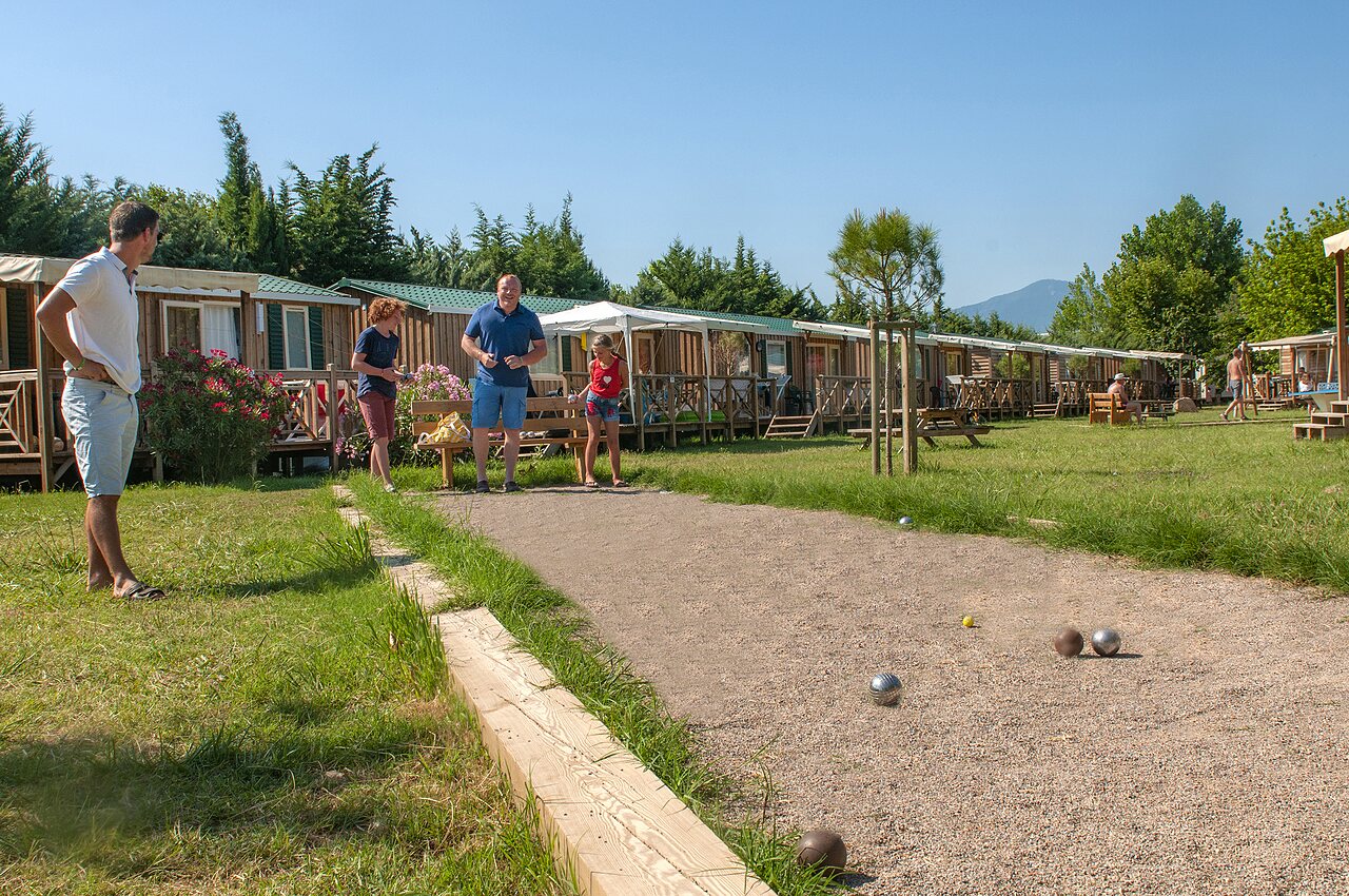 Family playing p�tanque, Mobile-homes at CAPFUN El Moli campsite in Elne (66).