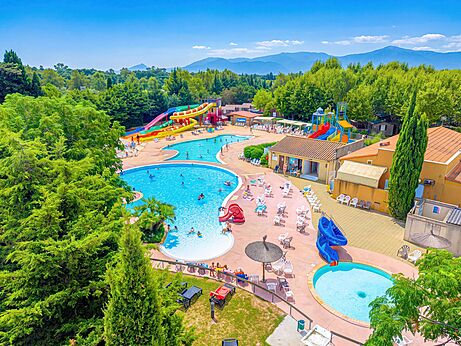 Outdoor pools with giant water slides at CAPFUN El Moli campsite in Elne (66).