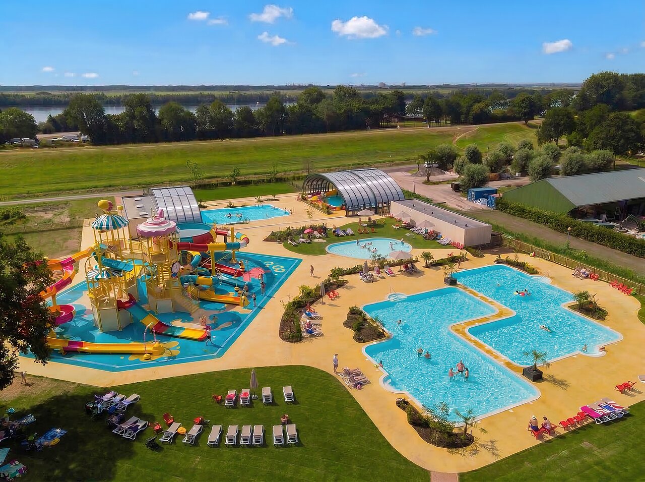 Water park, slides and outdoor pools at CAPFUN Erkemederstrand campsite in Zeewolde.