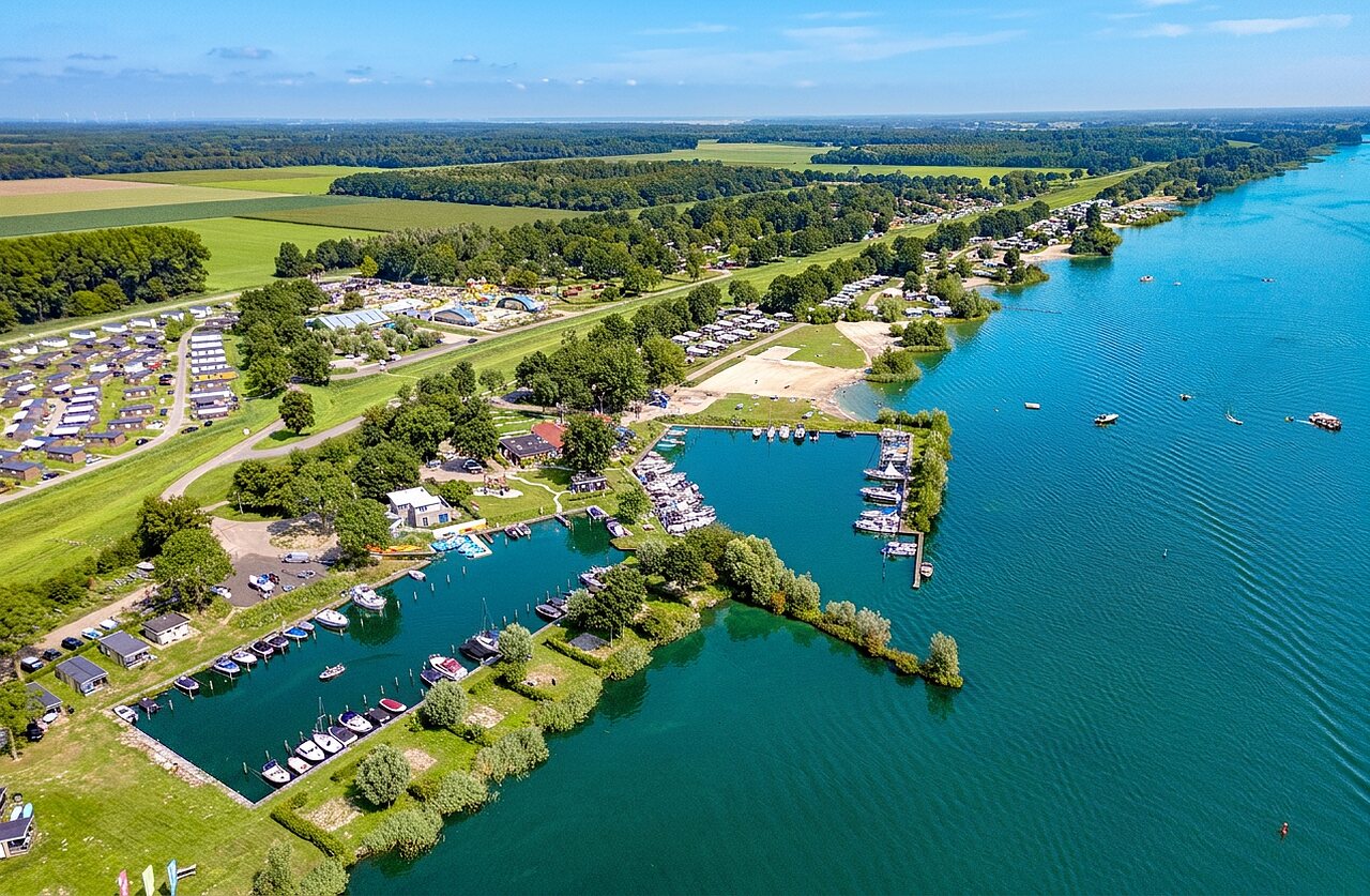 Aerial view of the marina and accommodations at CAPFUN Erkemederstrand campsite in Zeewolde.