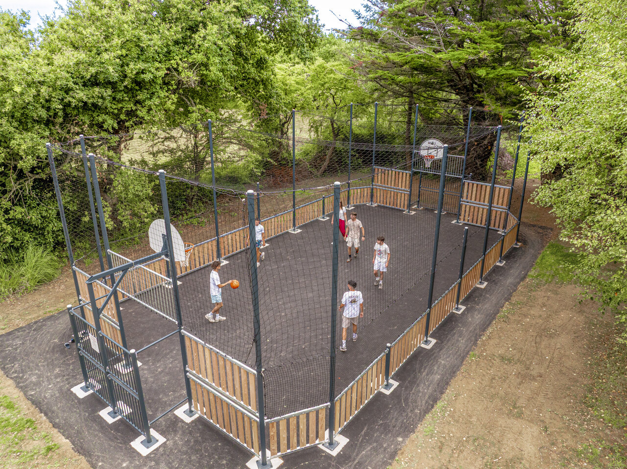 Multisport court, basketball game at CLICOCHIC Etoile de Mer, Asserac (44).