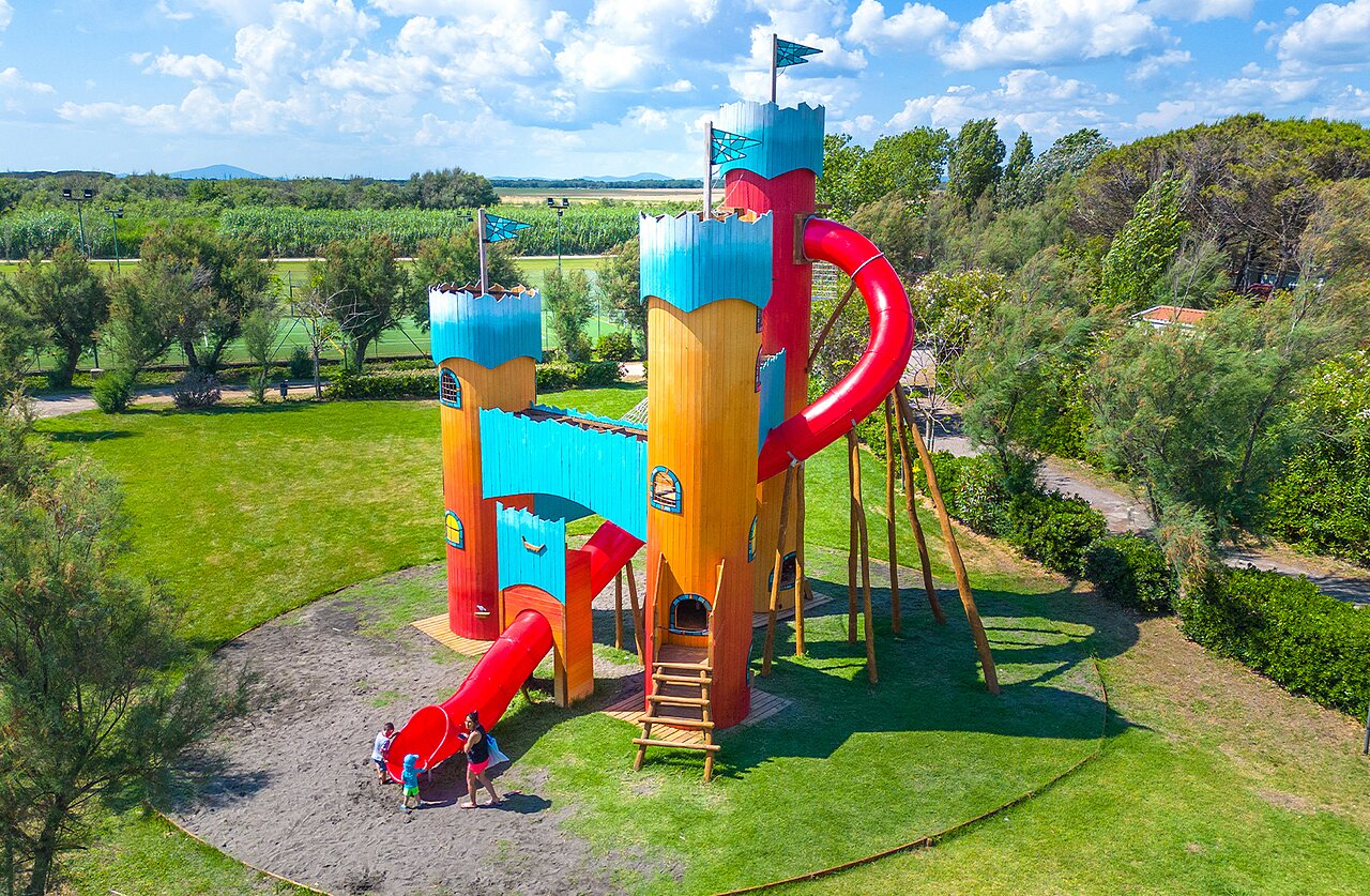 Giant castle playground with slides at CAPFUN Europing campsite in Tarquinia (01).