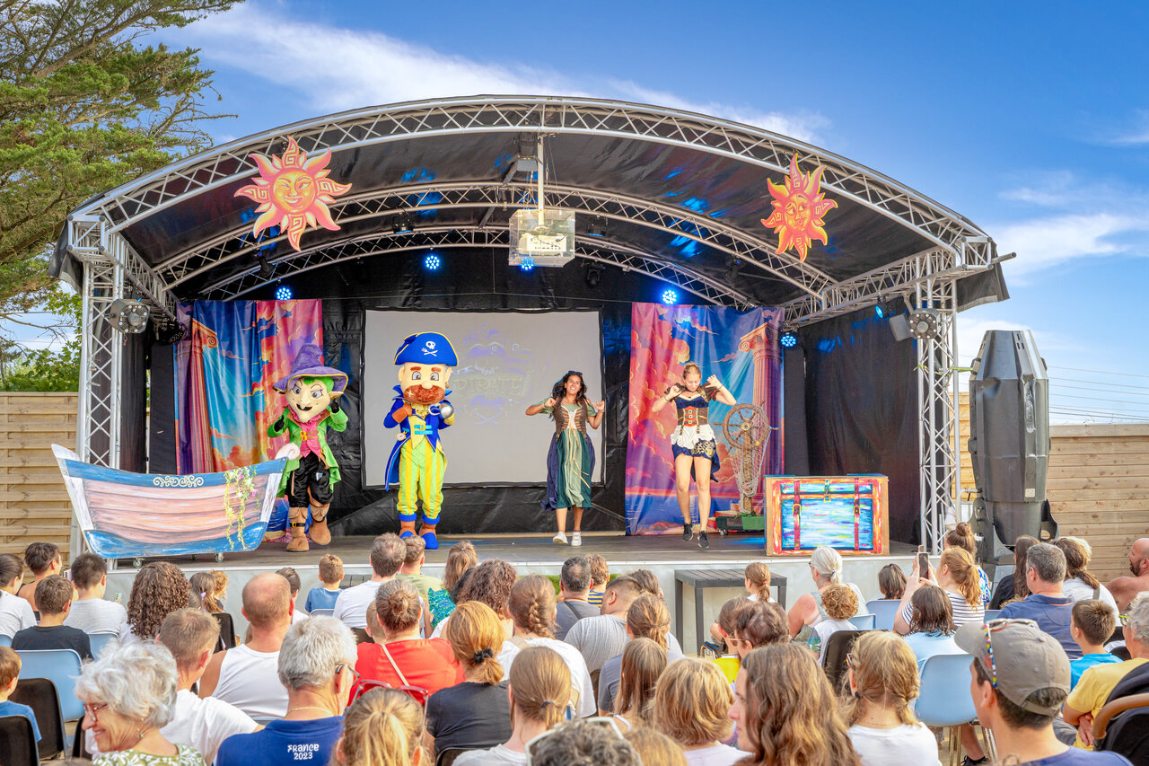 Animation show with mascots and artists on stage at CAPFUN L'Eve campsite.