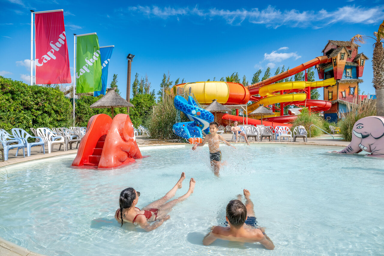 Water park with colorful slides and family pool at CAPFUN F�erix campsite in MARSEILLAN PLAGE (34).