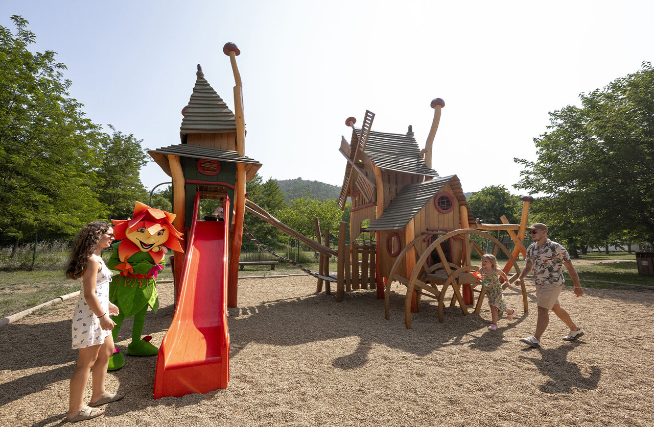 Wooden playground, slide, mascot at CLICOCHIC Filament campsite in Thoiras.