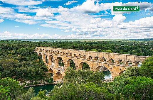 Majestic Pont du Gard, historic Roman aqueduct, surrounded by green nature near N�mes.