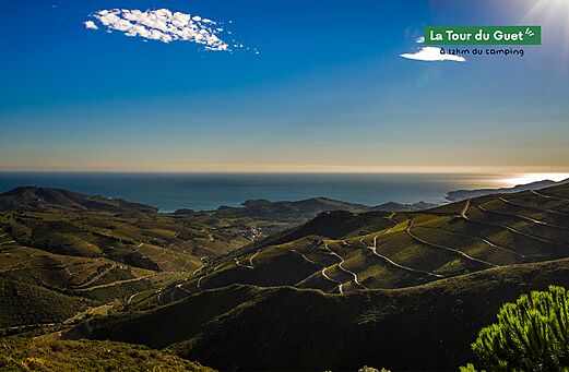 Panoramic view of the coast and hills from La Tour du Guet.