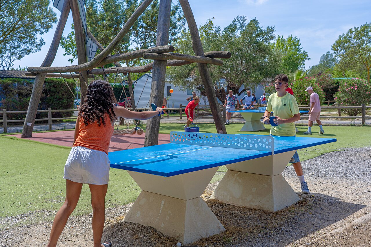 Young people playing outdoor table tennis at CAPFUN Fleurs d'Agde, AGDE.